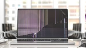 Computer,Laptop,With,Broken,Screen,On,Blur,Office,Business,Background.
